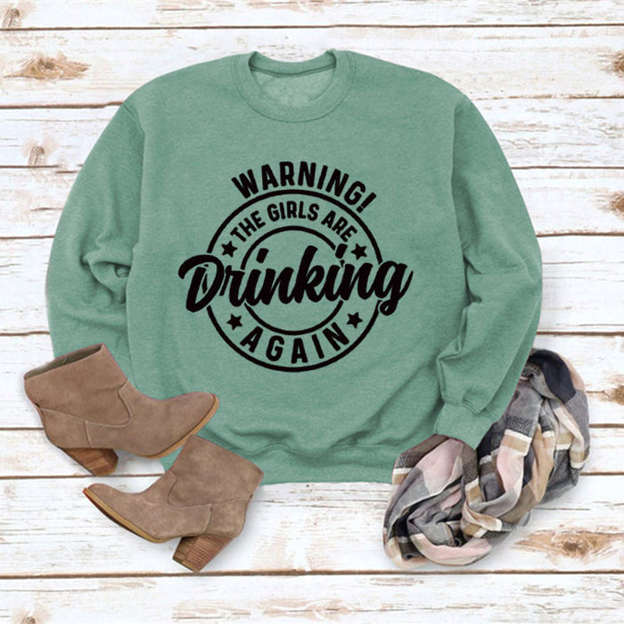 Light green sweater (black font) / S