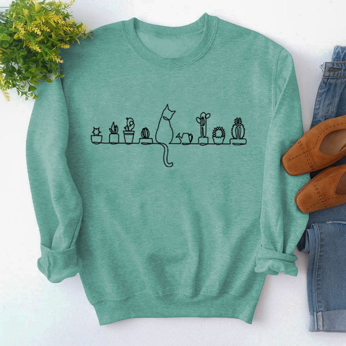 Light green sweater (black font) / S