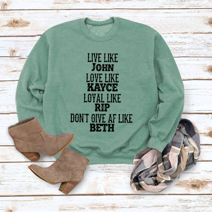 Light green sweater (black font) / S