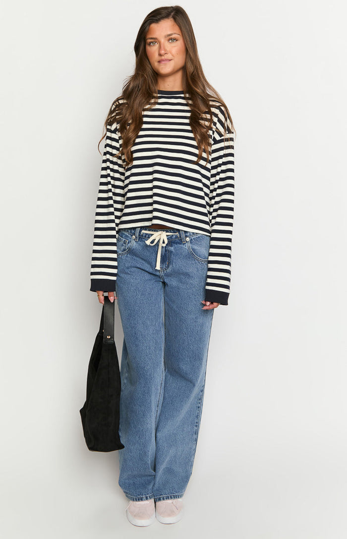 Navy and white striped long sleeve top with a relaxed fit and slightly cropped hem