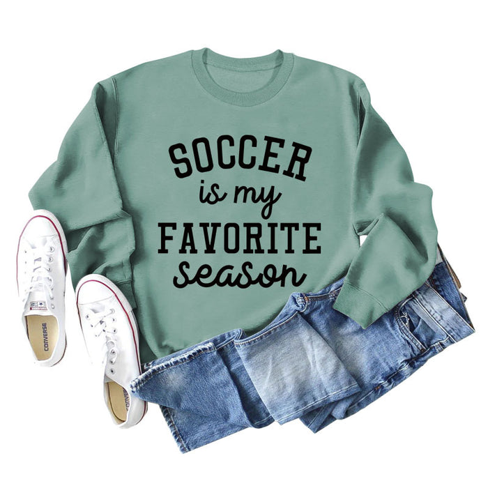 Light green sweater (black font) / S