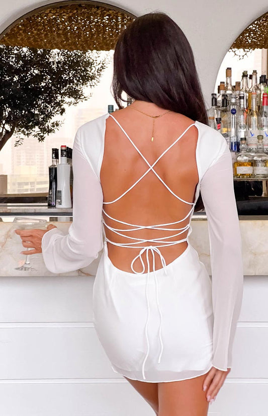Beginning Boutique Tala White Long Sleeve Mini Dress white long sheer sleeve mini dress with open back and criss-cross tie straps