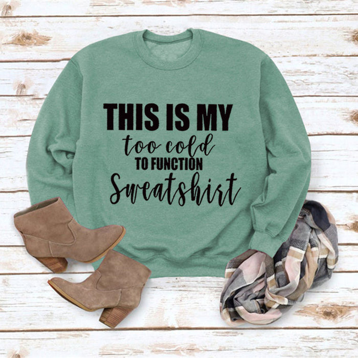 Light green sweater (black font) / S