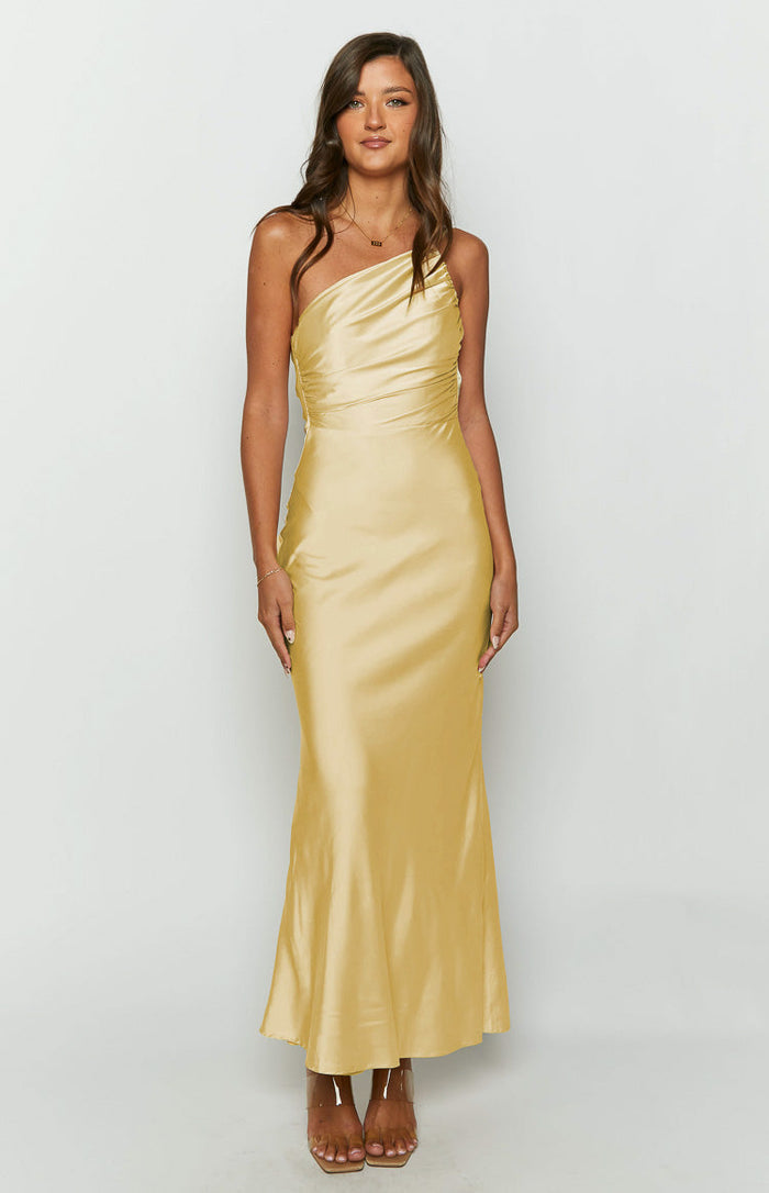 Front view of a yellow satin one-shoulder maxi dress with a ruched bodice