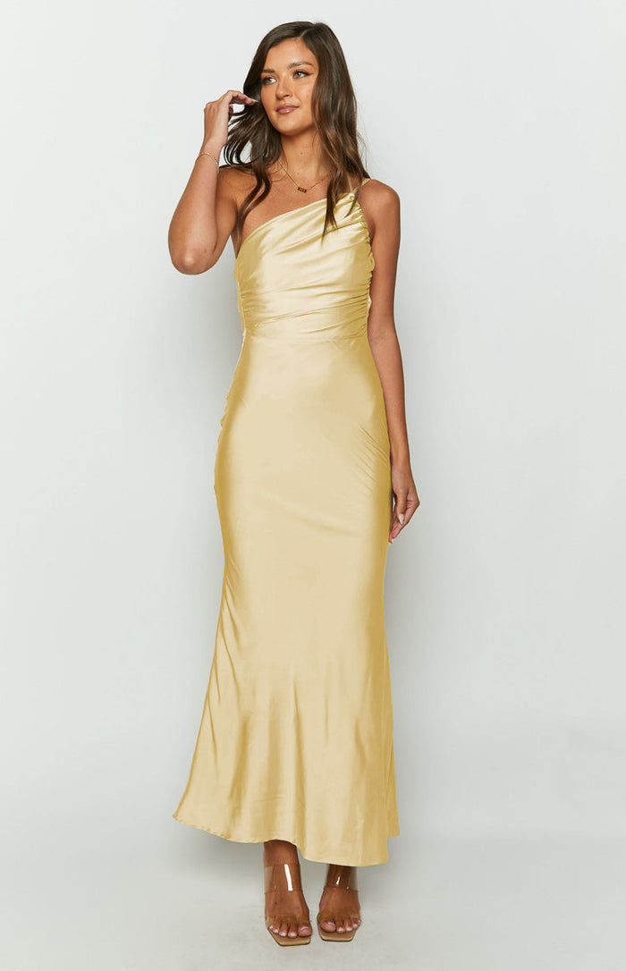 Front view of a yellow satin one-shoulder formal maxi dress with a ruched bodice and fitted skirt