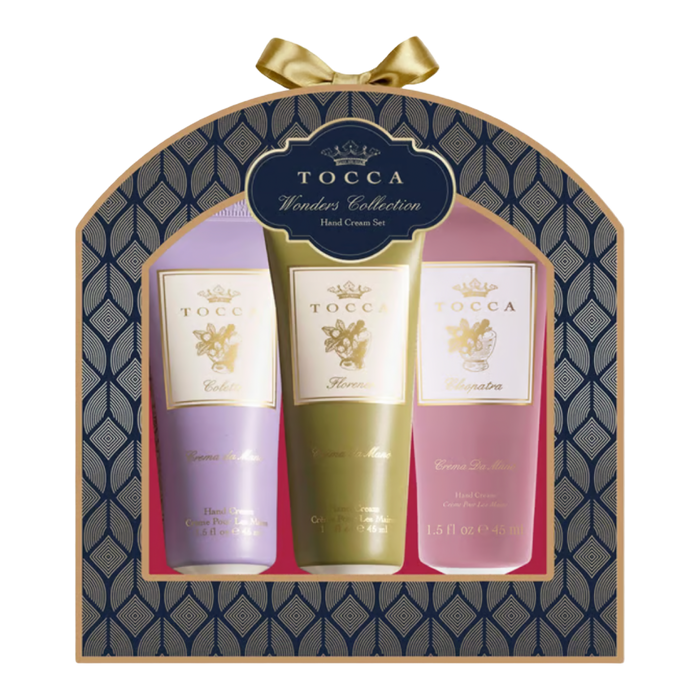 TOCCA Wonders Collection three-piece hand cream gift set with Florence, Cleopatra, and Colette in decorative navy and gold packaging.
