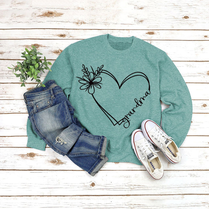 Light green sweater (black font) / S