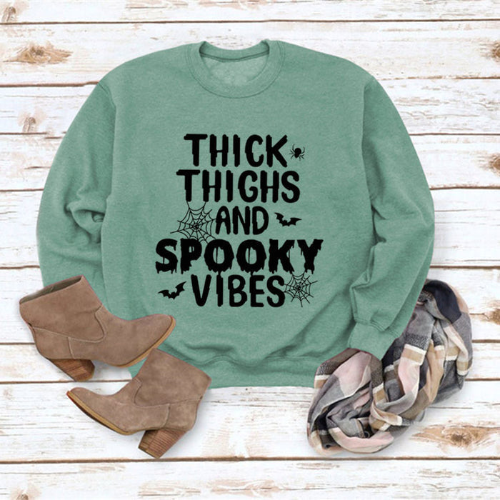 Light green sweater (black font) / S