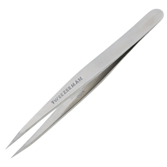 Metallic tweezers with 'Tweezeerman' branding on a white background