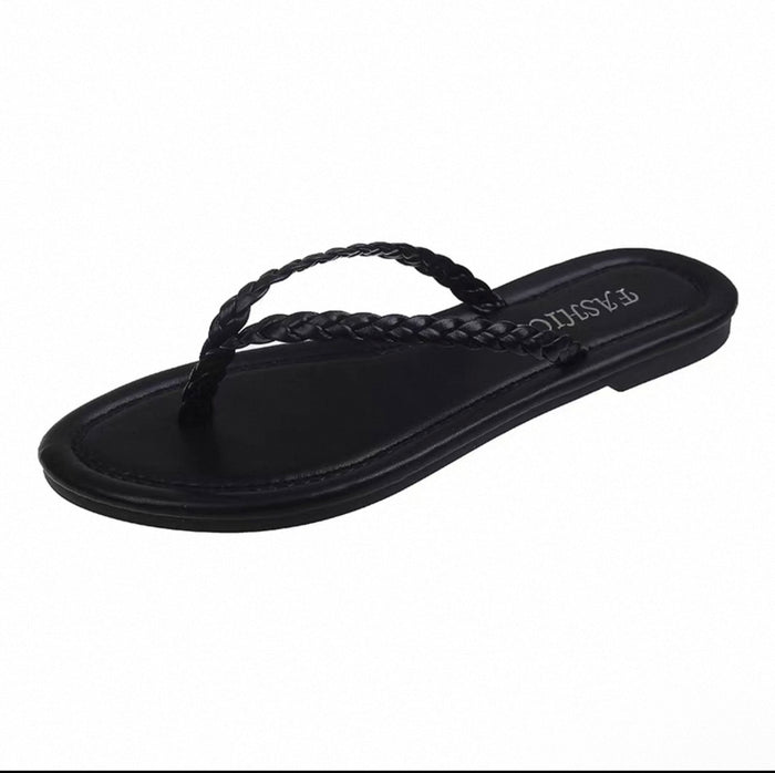 Black sandal with braided design on a white background