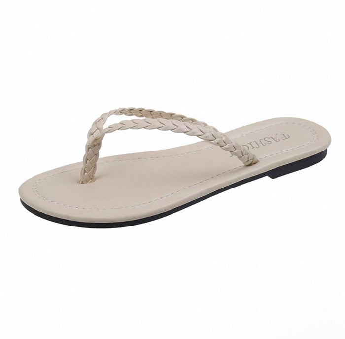 Beige sandal with braided design on a white background