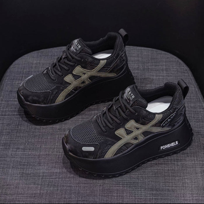 Black and gray sneakers on a textured surface with 'FONSHELS' branding.