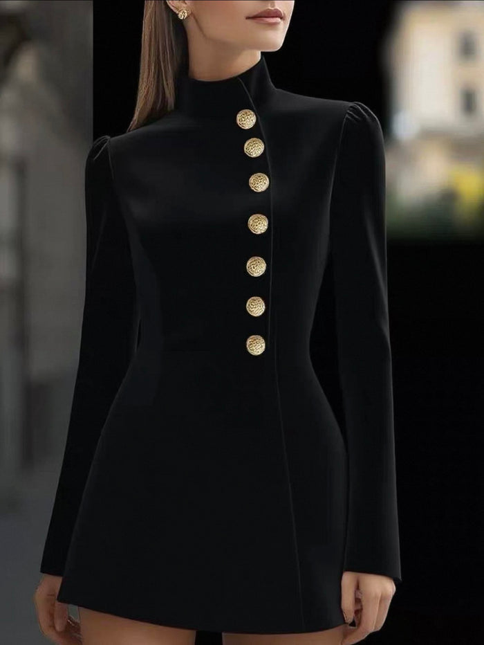 Black dress with gold buttons worn by a model against a blurred background