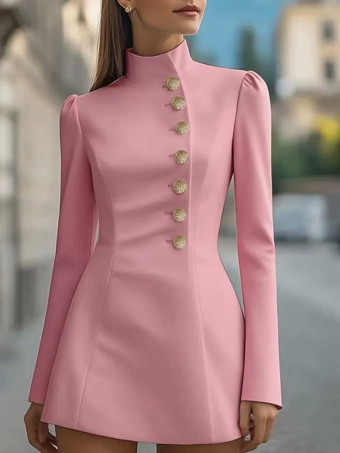 Pink dress with gold buttons worn by a model outdoors