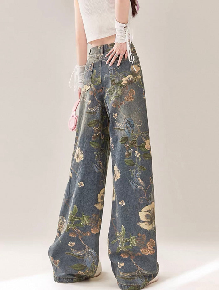 Floral patterned pants worn by a person on a plain background