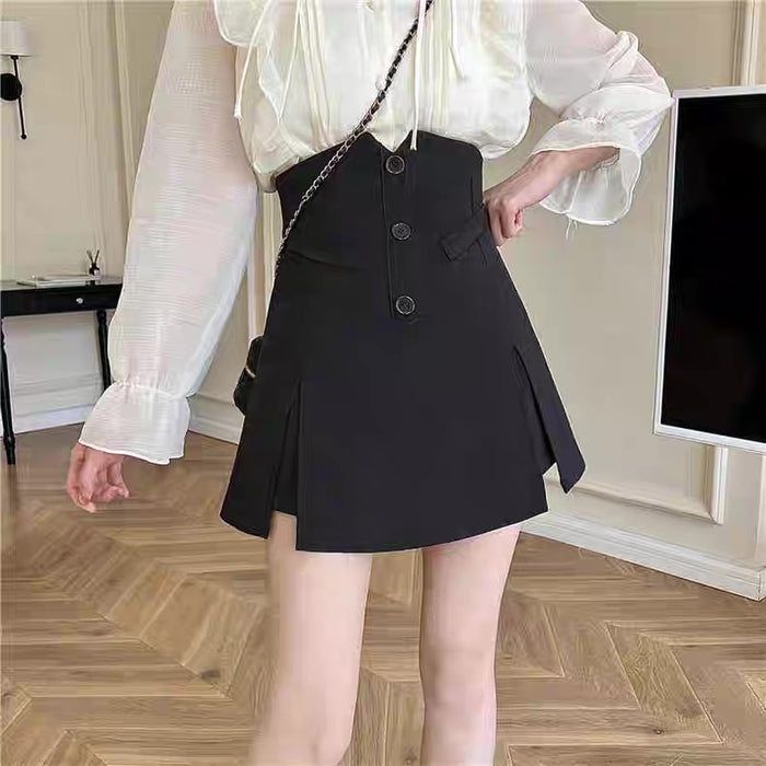 Person wearing a white blouse and black skirt in an indoor setting