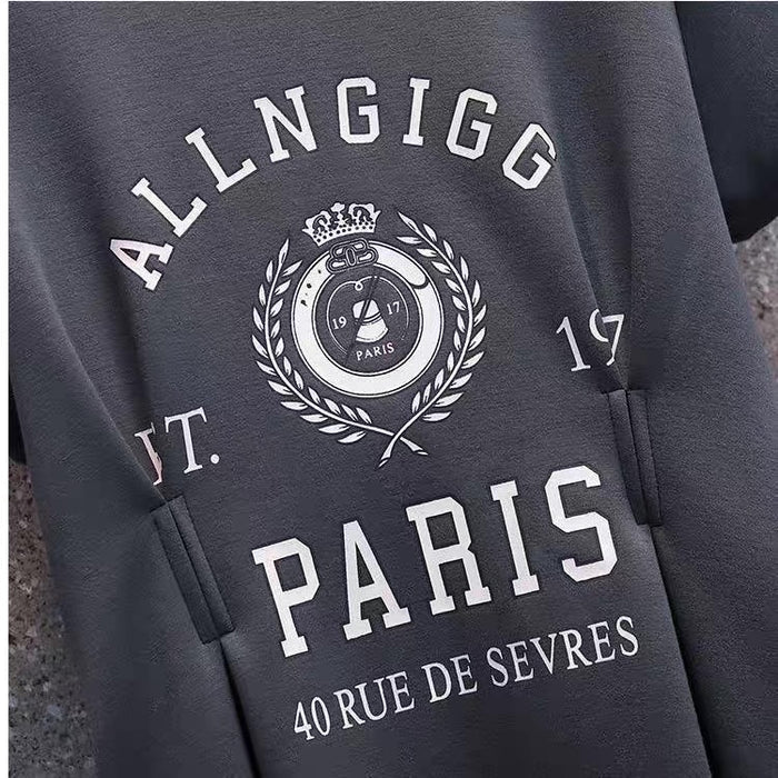 Gray sweatshirt with 'ALLNGIGG PARIS' text and logo on a textured surface