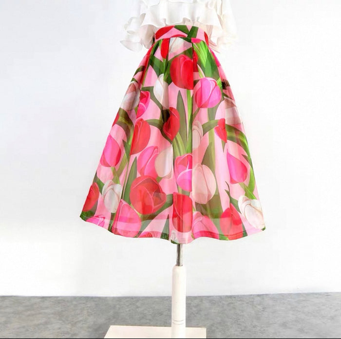 Floral skirt on a mannequin against a white background
